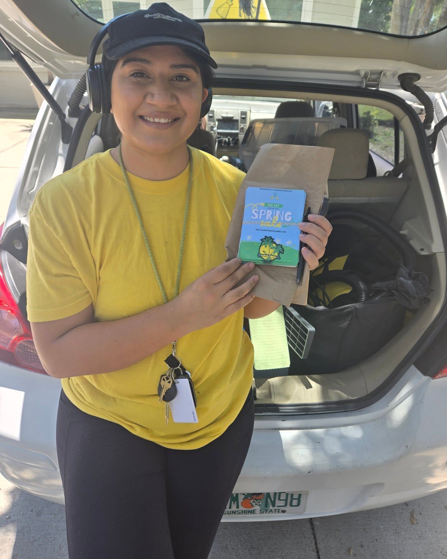 Reina Charles, founder of Good Rising Cleaning, with cleaning supplies